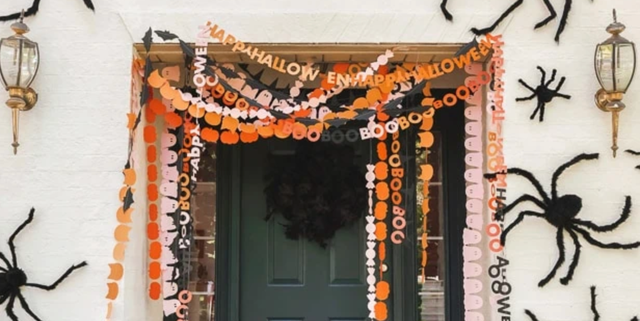 A mix of store-bought and DIY outdoor decorations setting a spooky yard scene.